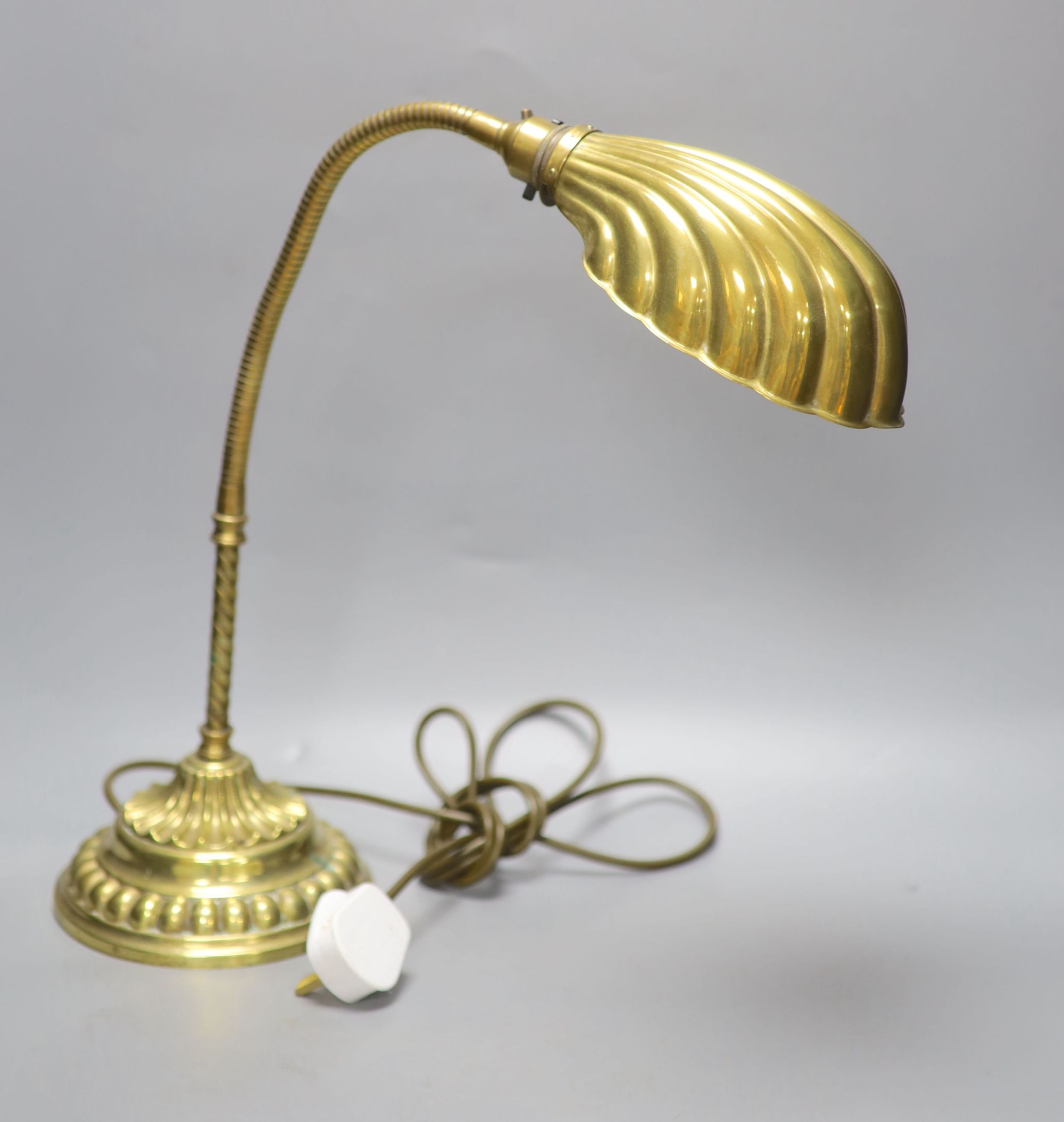 A brass anglepoise shell desk lamp